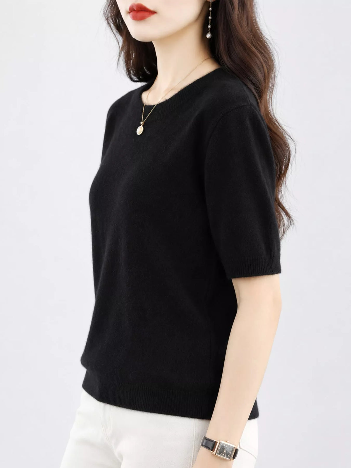 Black round-neck short-sleeve sweater with ribbed cuffs and hem
