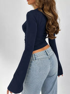 Navy lace-trim V-neck long-sleeve tee with flared sleeve opening, side view