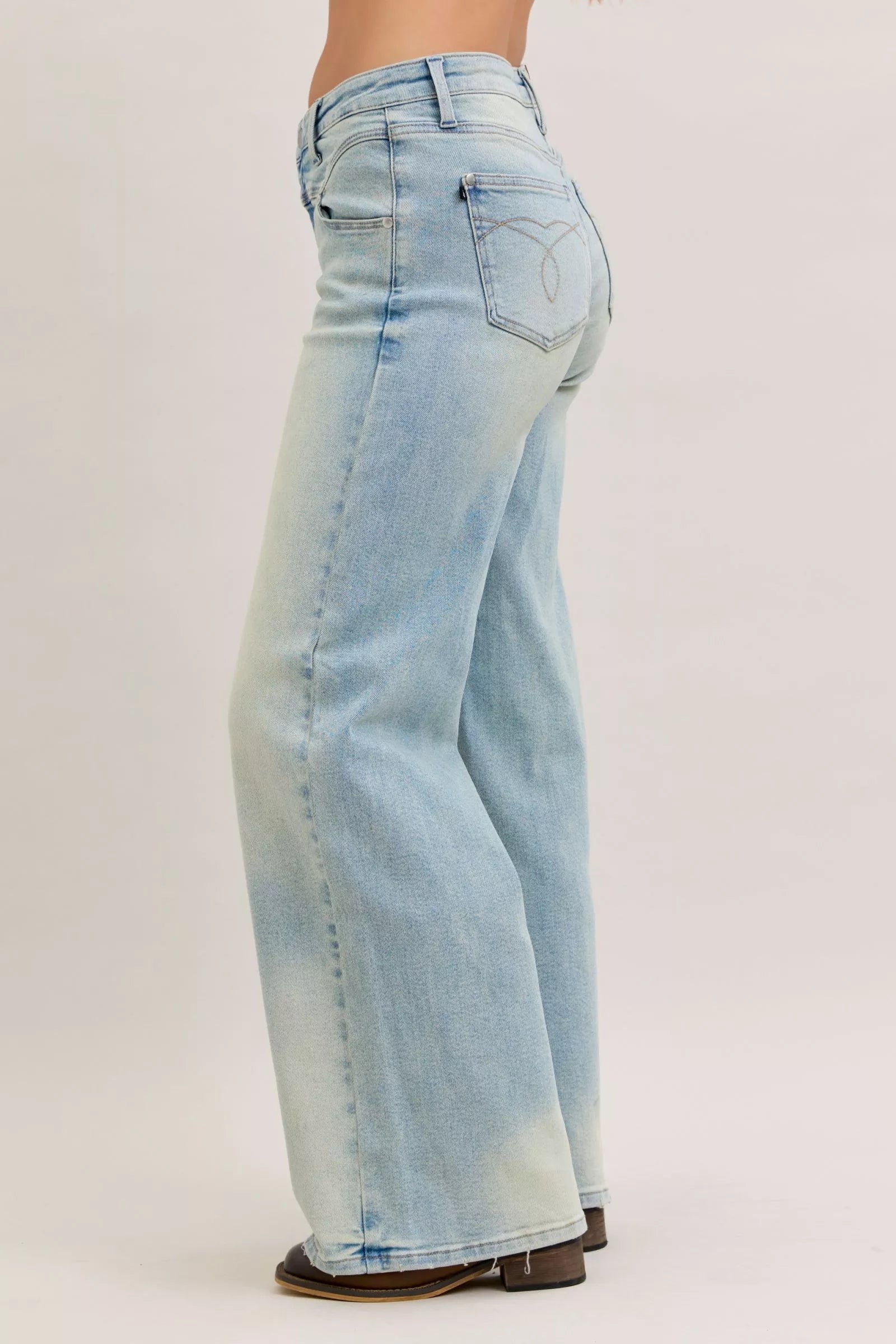 Light blue high-waist straight jeans back view with patch pockets and long straight legs