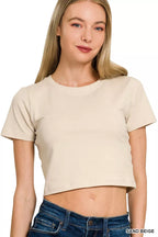 Sand beige cropped top with short sleeves and round neck