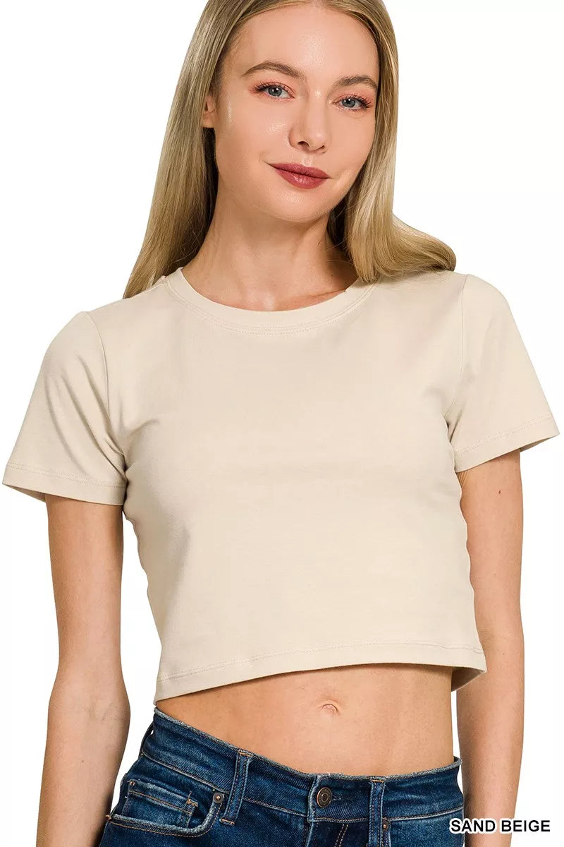 Sand beige cropped top with short sleeves and round neck