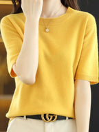 Bright yellow round-neck short-sleeve sweater with ribbed hem and sleeve edges