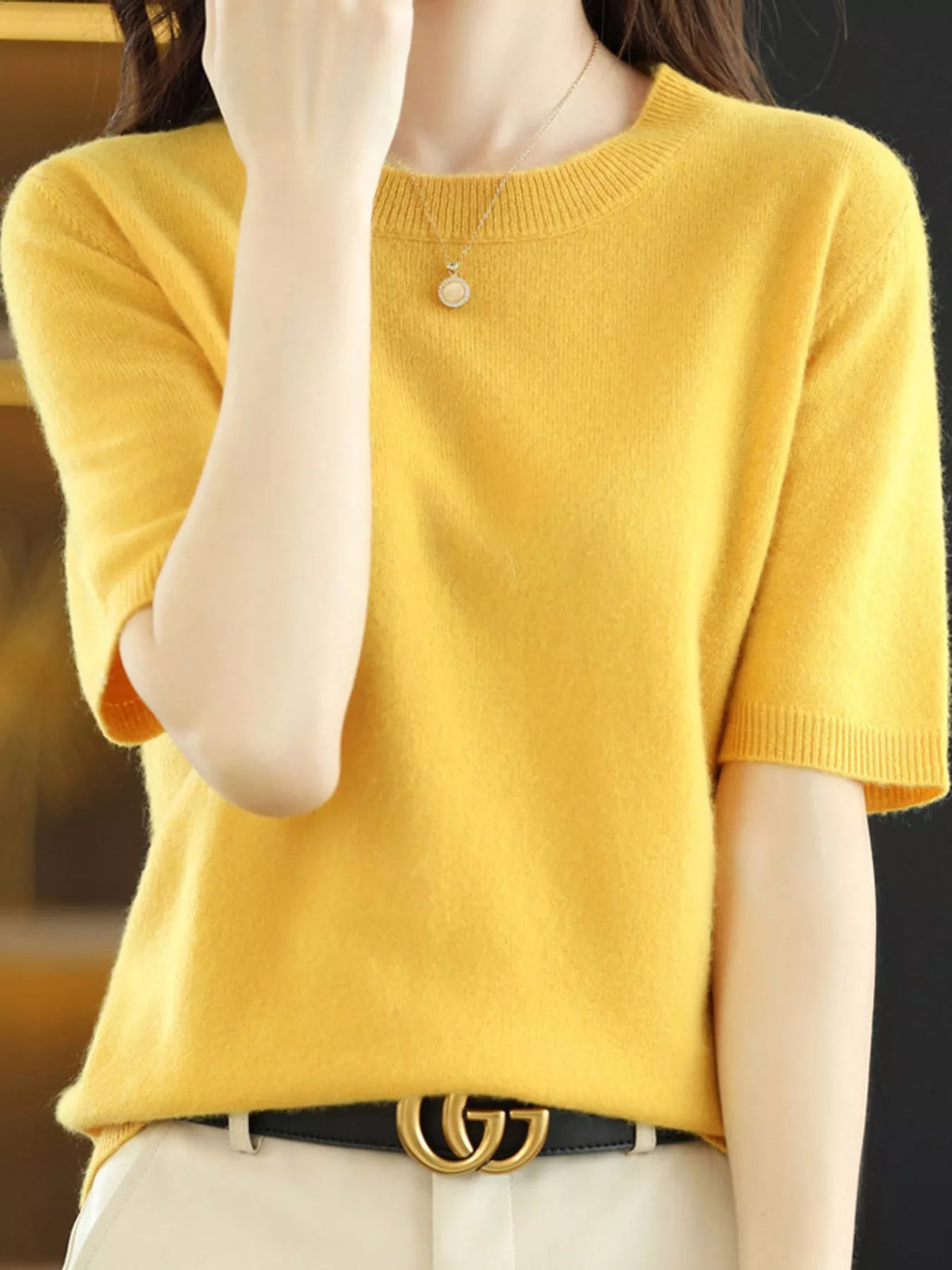 Bright yellow round-neck short-sleeve sweater with ribbed hem and sleeve edges