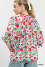 Red-and-blue mixed floral ruffle top, back view with three-quarter ruffle sleeves