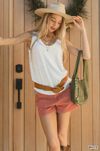 White sleeveless tank top with scoop neck and raw-edge hem detail