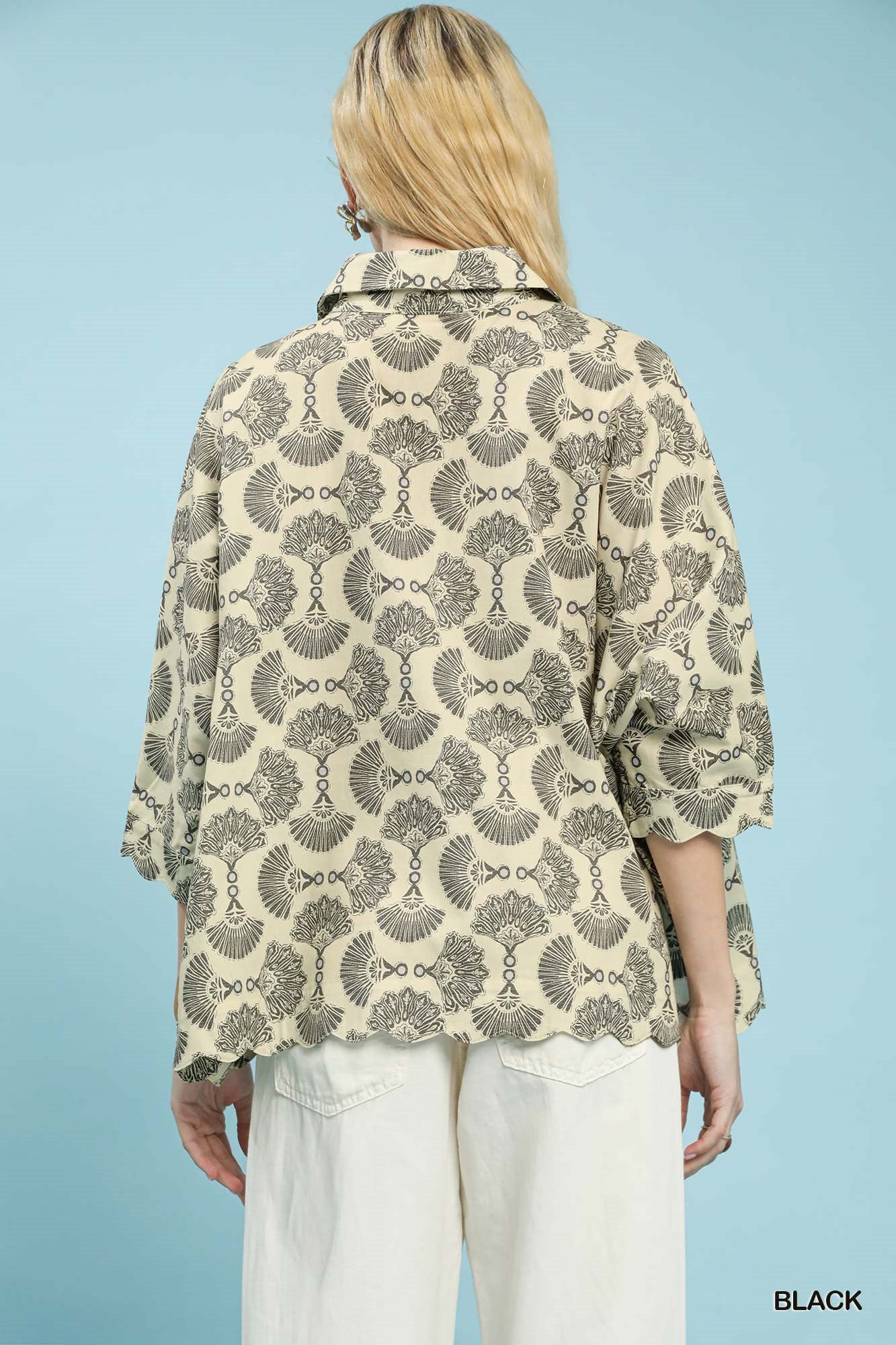 Back view of printed cotton button-down blouse with dark fan motif and cuffed sleeves