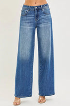 Women's medium-wash denim jeans, slouchy baggy relaxed fit, front button, pockets