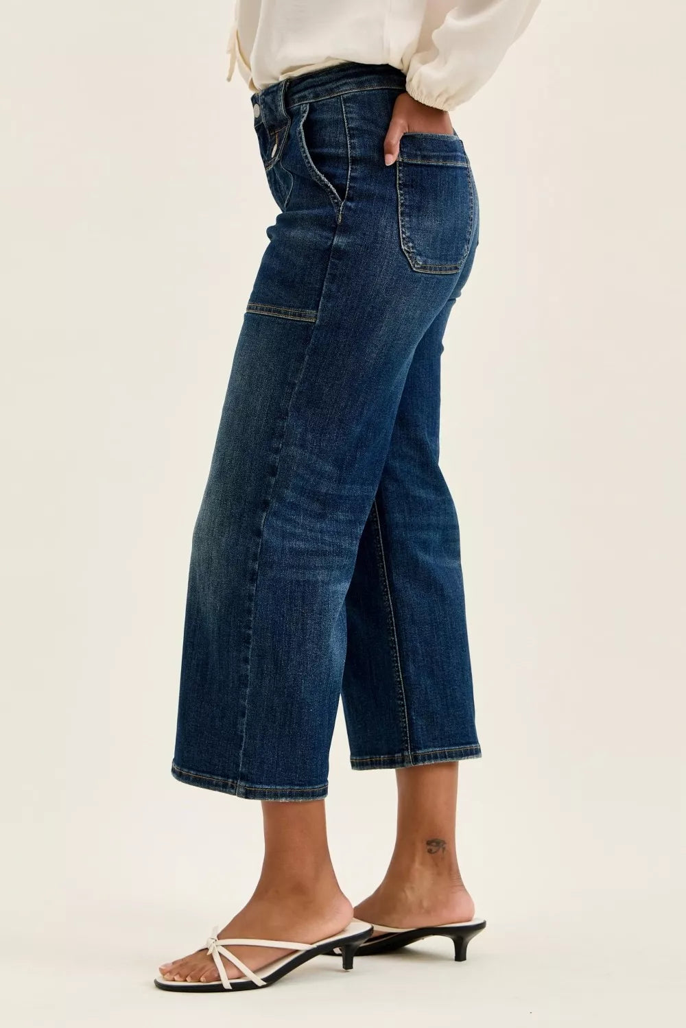 Women’s high-waist wide-crop utility jeans, dark blue denim, back view with seam detail
