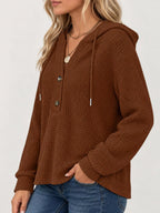 Brown waffle-knit button hoodie side view with hood, long sleeves, and button placket