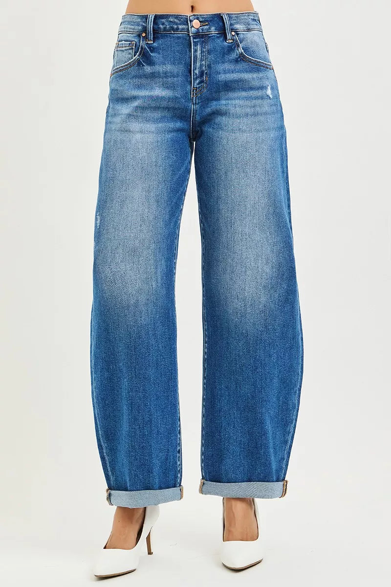 Dark wash mid-rise barrel jeans with button front and double roll cuffs