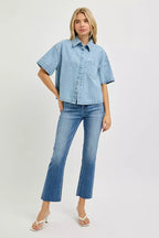 Light blue denim oversized cropped half-sleeve shirt with button front, full model view