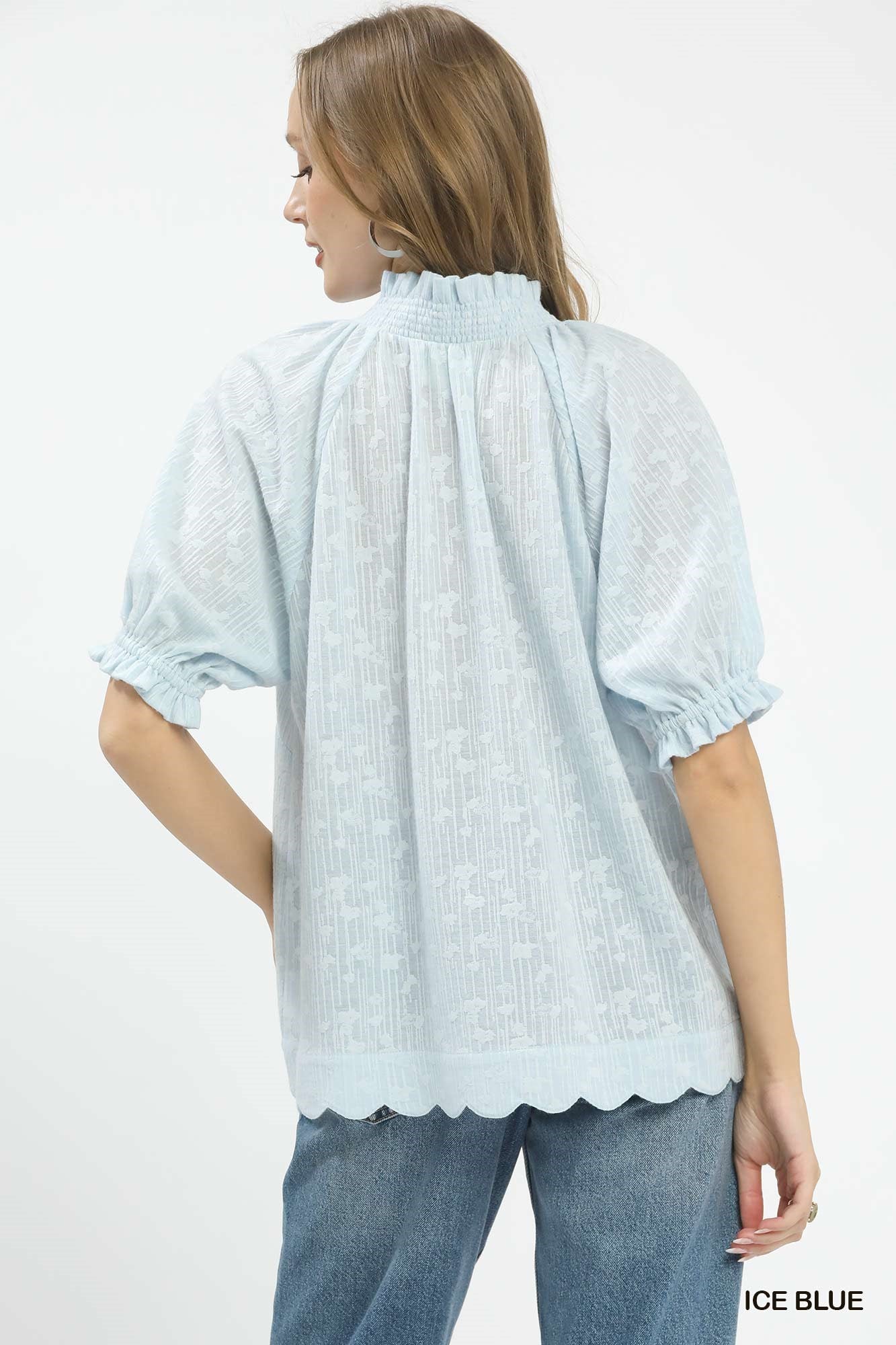 Ice blue pintuck blouse with gathered high back yoke, puff sleeves, scalloped hem
