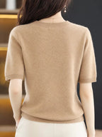 Beige round-neck short-sleeve sweater, back view with ribbed hem and cuffs