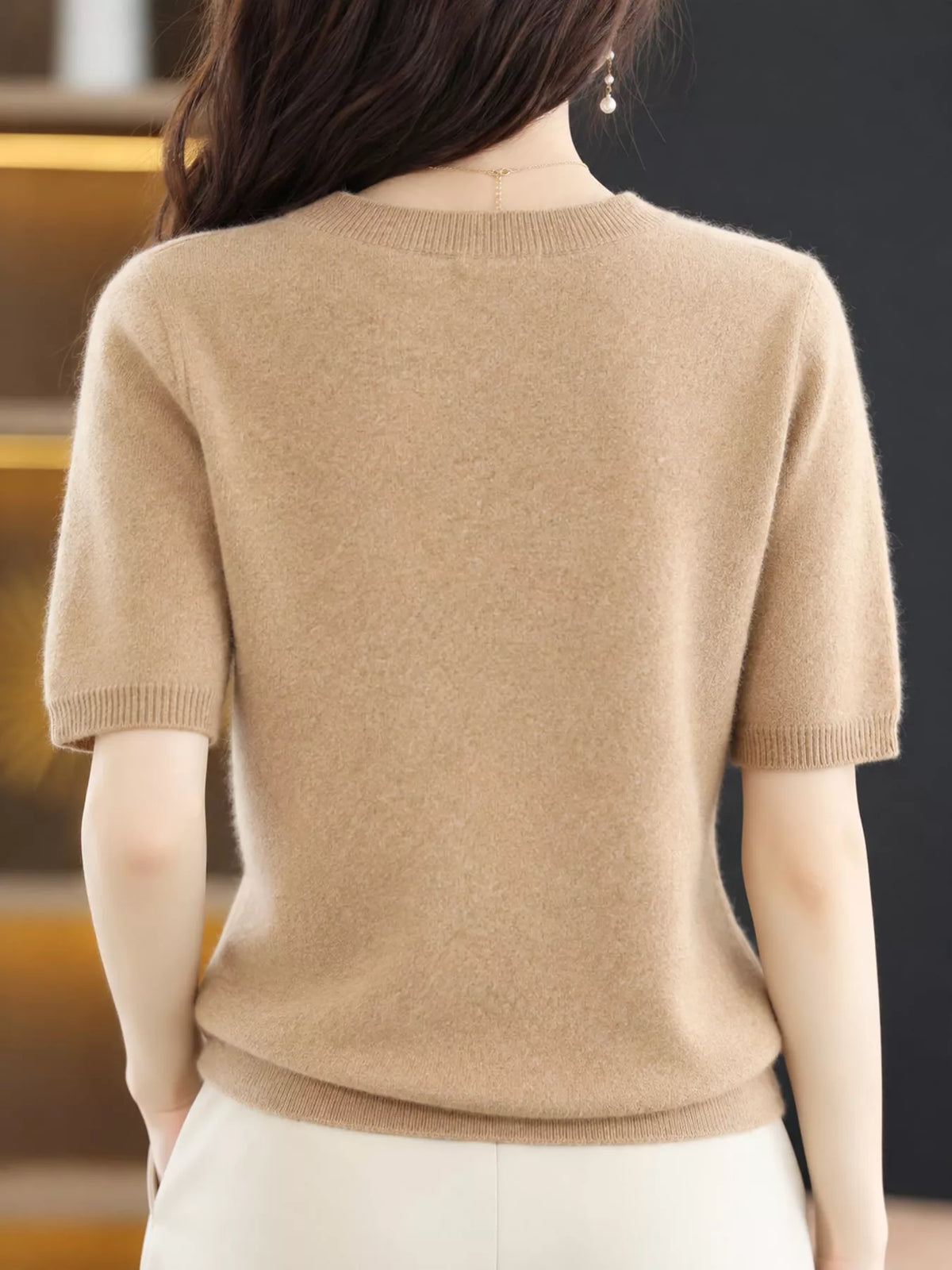 Beige round-neck short-sleeve sweater, back view with ribbed hem and cuffs