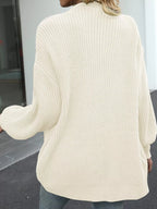 Beige chunky knit cardigan back view with ribbed texture and wide sleeves