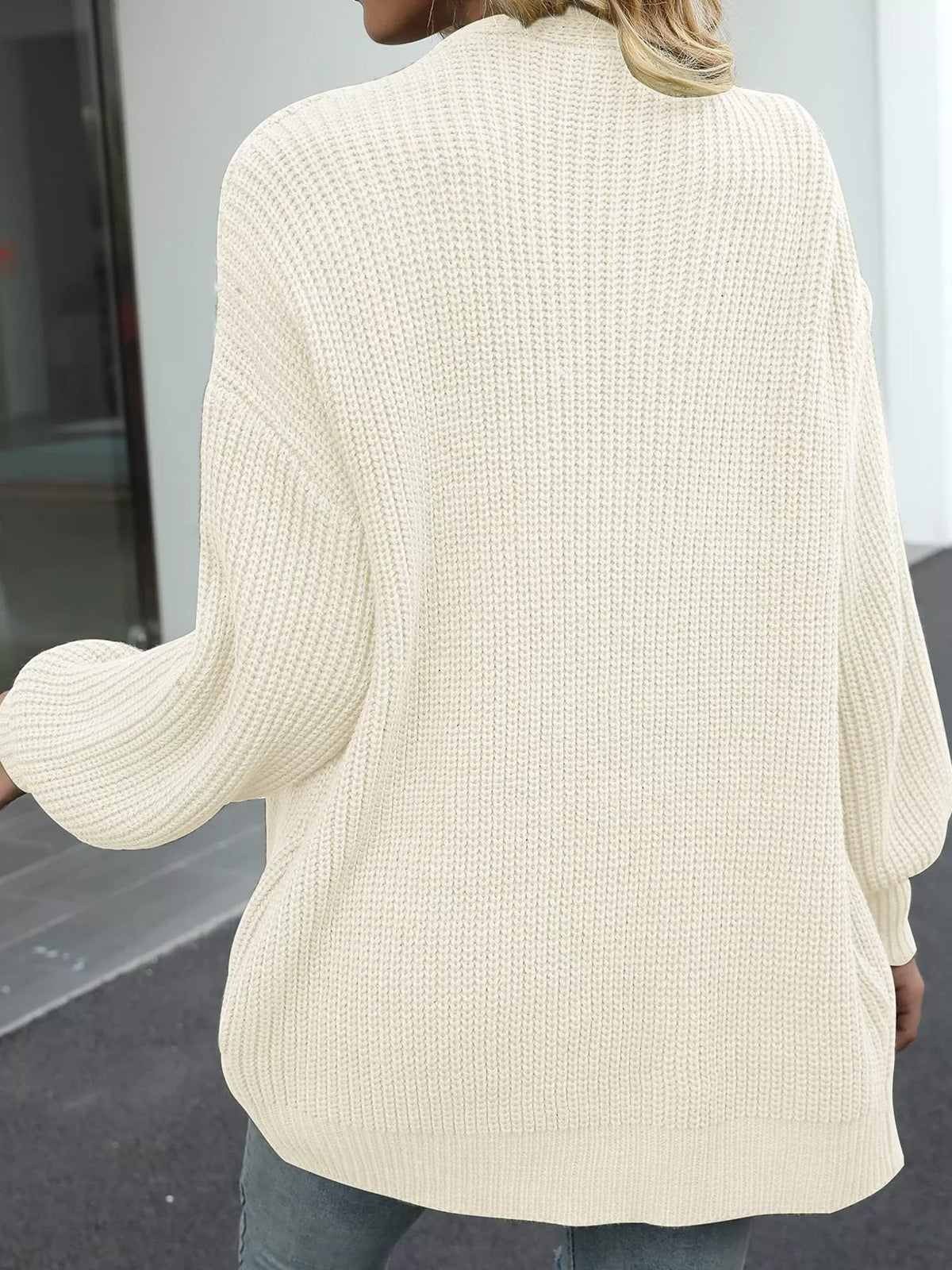 Beige chunky knit cardigan back view with ribbed texture and wide sleeves