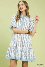 Light blue floral-print tiered mini dress with button front and striped trim