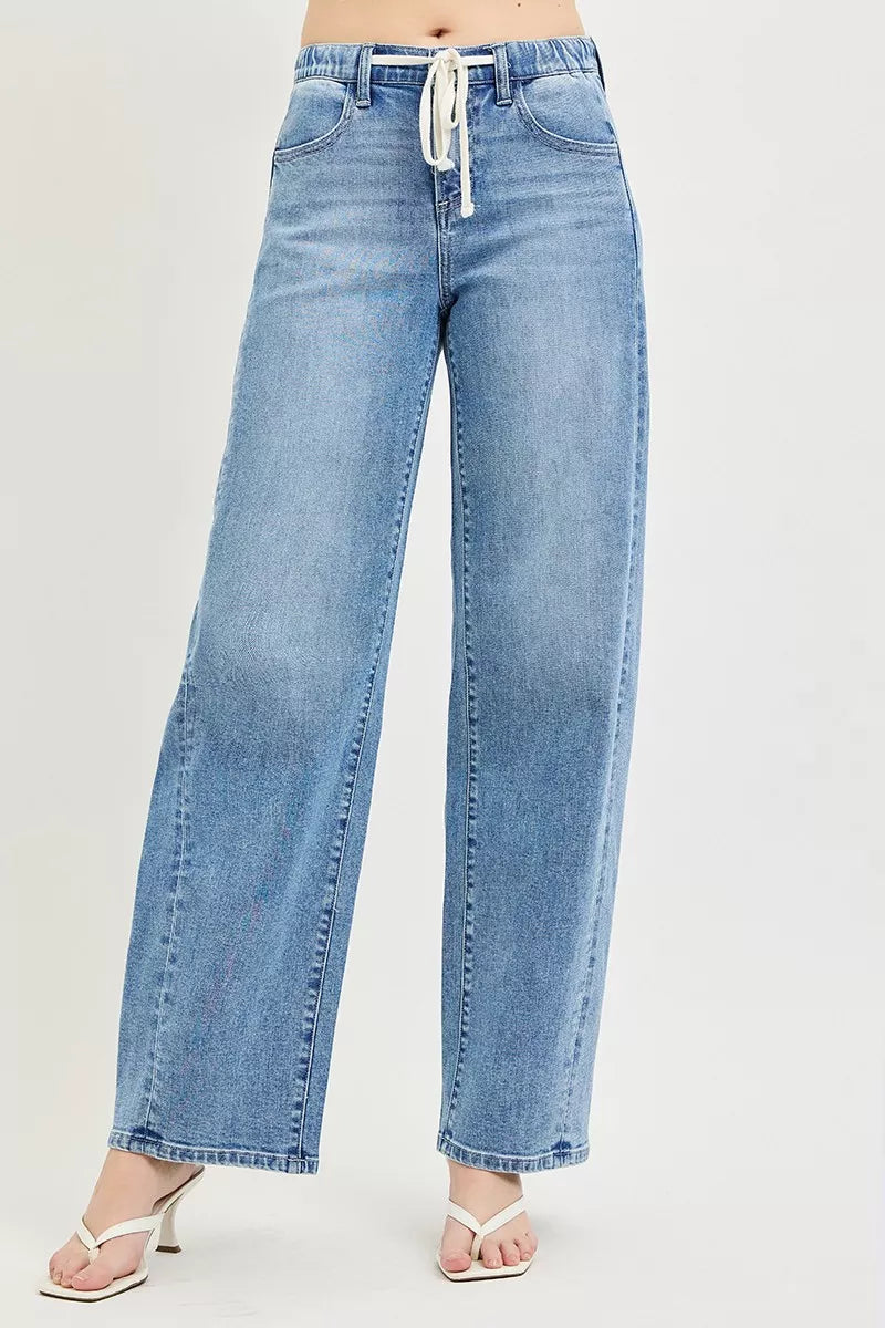 Light wash relaxed fit jeans with drawstring waist and side pockets