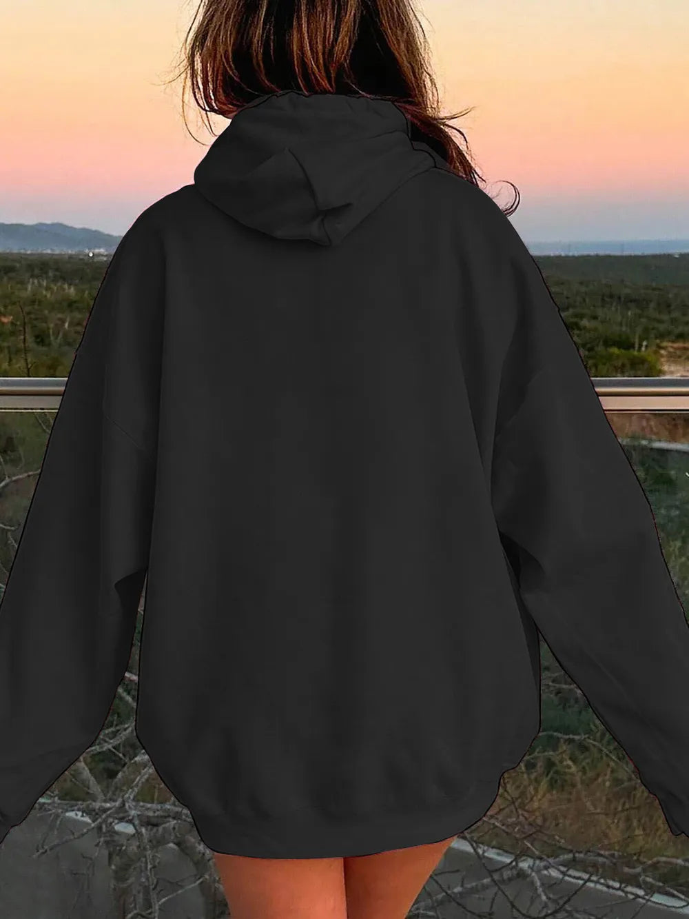 Black back view hoodie with drawstring hood and relaxed dropped-shoulder silhouette