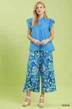Ocean blue smocked yoke ruffle cap sleeve blouse with gathered front