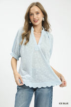 Ice blue pintuck ruffle blouse with V-neck and puff sleeves, scalloped hem