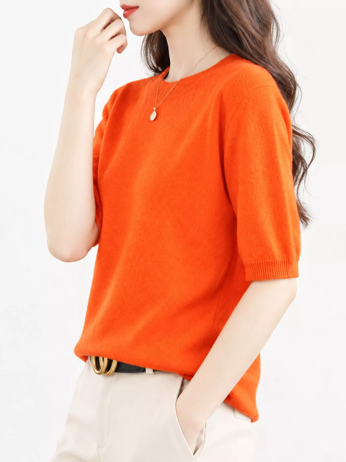 Bright orange round-neck short-sleeve sweater with ribbed cuffs and hem