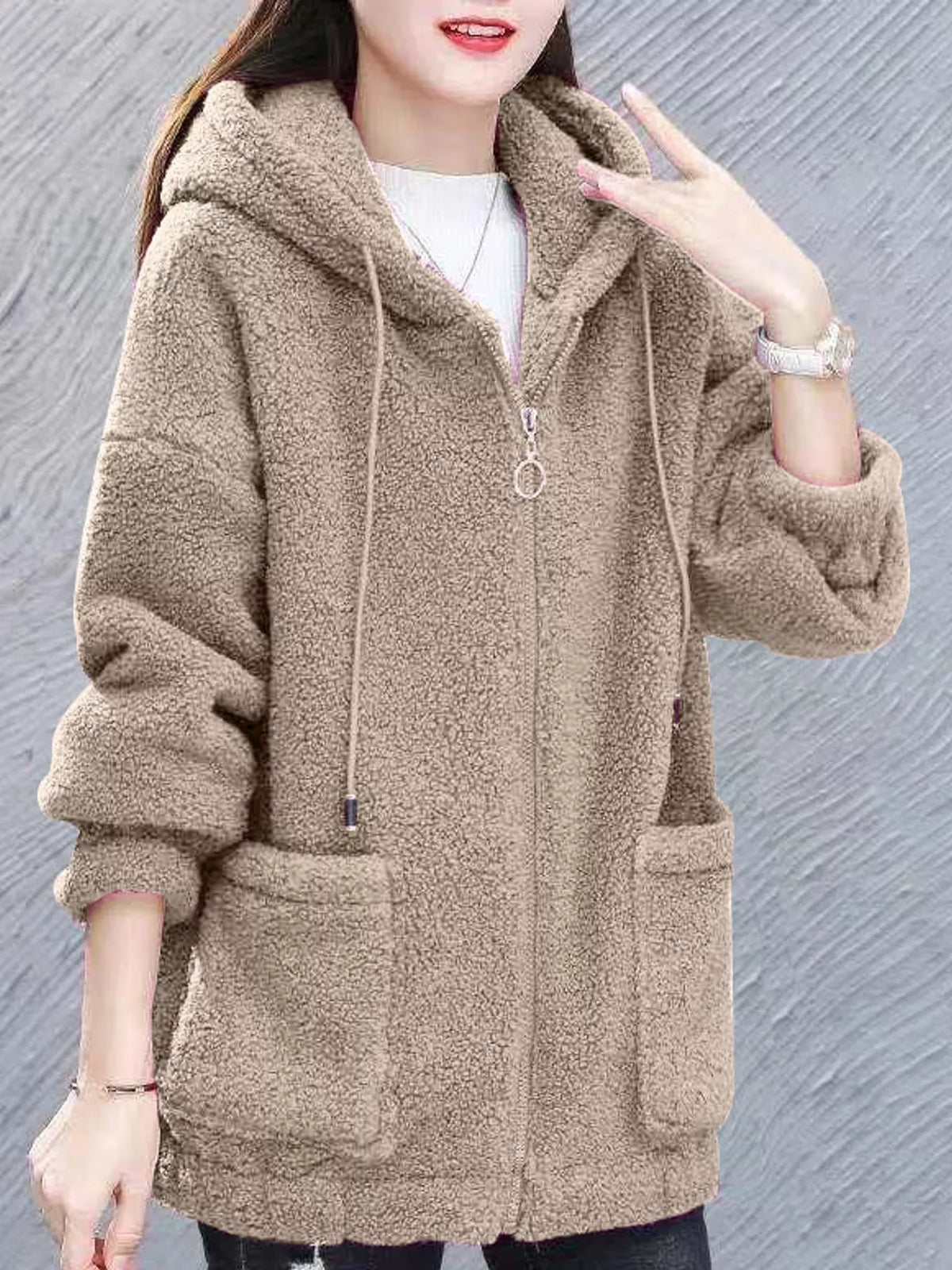 Khaki/beige fleece zip-up hoodie with drawstring hood, front zipper, and patch pockets.