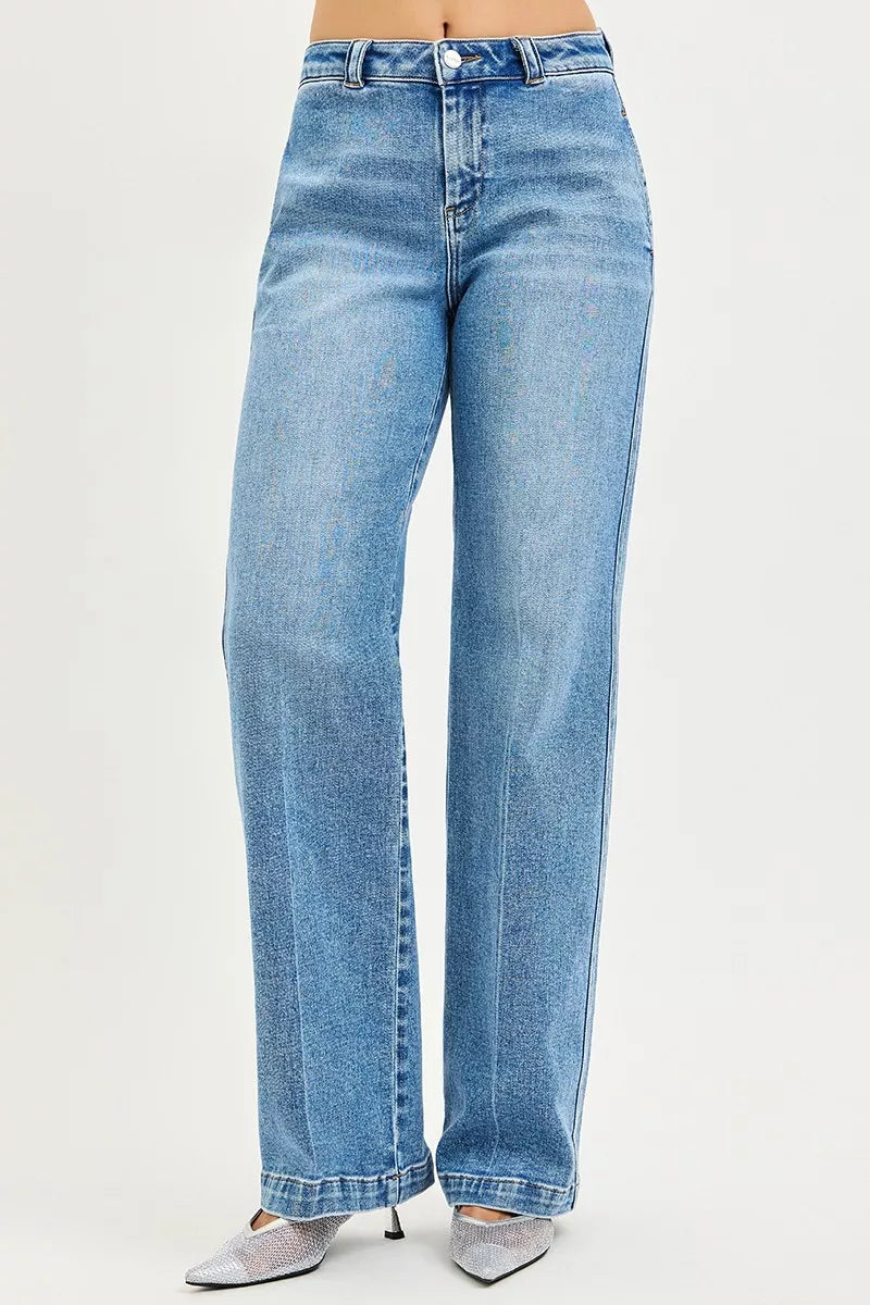 Women's medium-wash straight jeans with relaxed fit, centered front seams