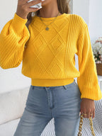 Yellow argyle knit sweater with lantern sleeves, crew neckline, and ribbed trim