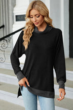 Black long-sleeve mock-neck slit tee with contrast hem band, front view