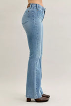 Light blue mid-rise bootcut jeans with back patch pocket and belt loops