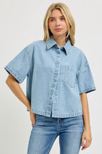 Light blue denim cropped half-sleeve shirt with button front and chest pocket