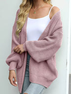 Chunky knit lantern sleeve cardigan in dusty rose, open front, dropped sleeves.