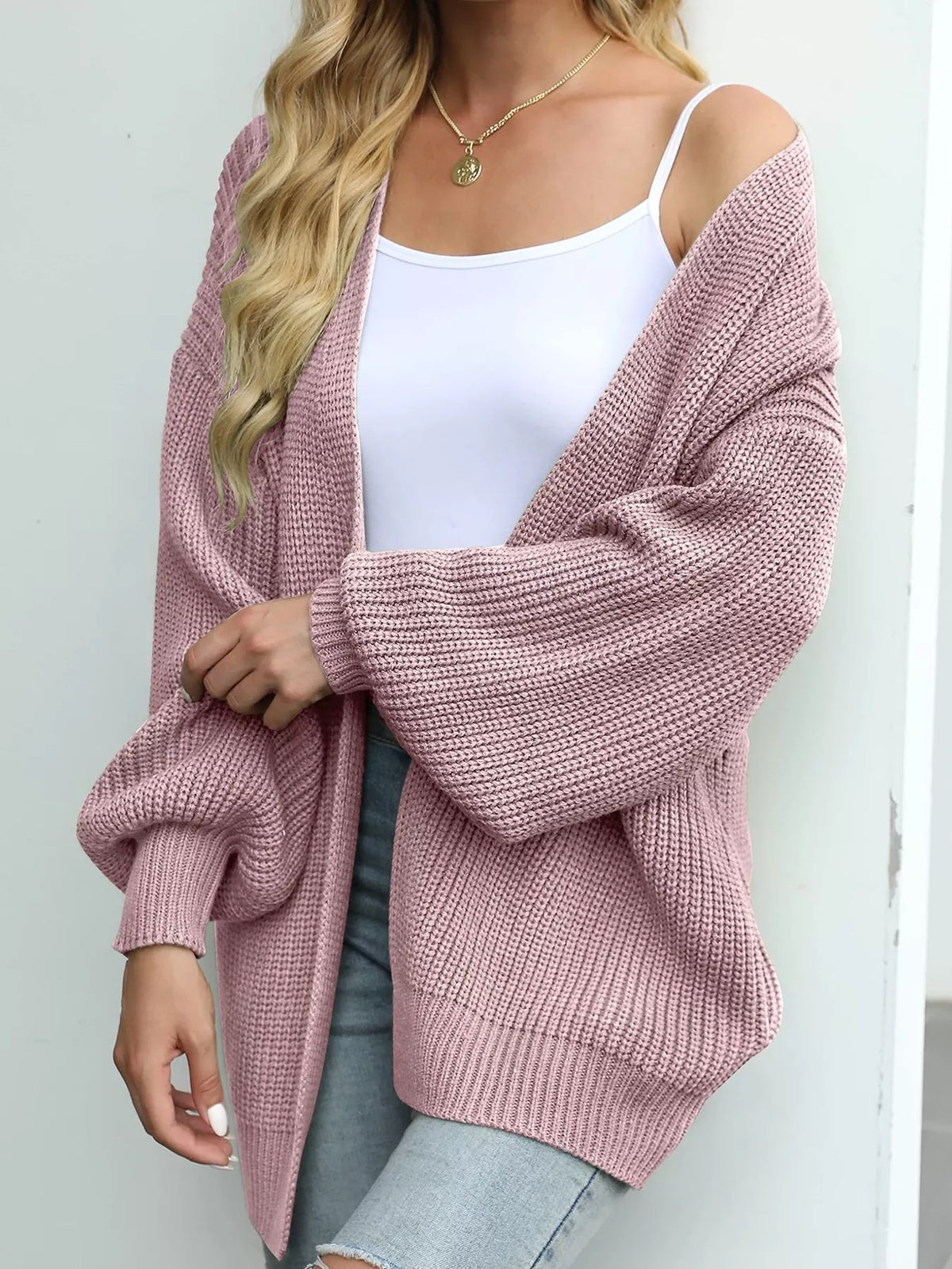 Chunky knit lantern sleeve cardigan in dusty rose, open front, dropped sleeves.