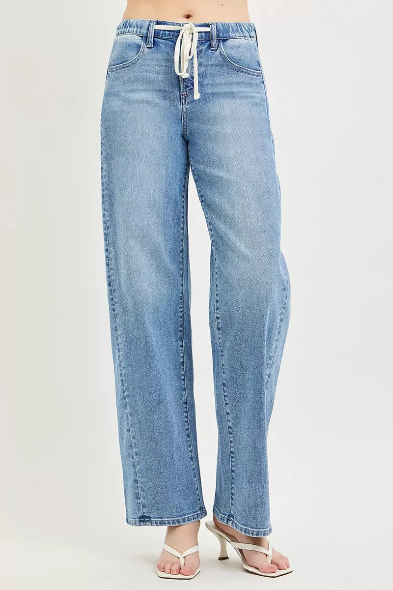 Light wash relaxed fit jeans with drawstring waist and wide straight legs