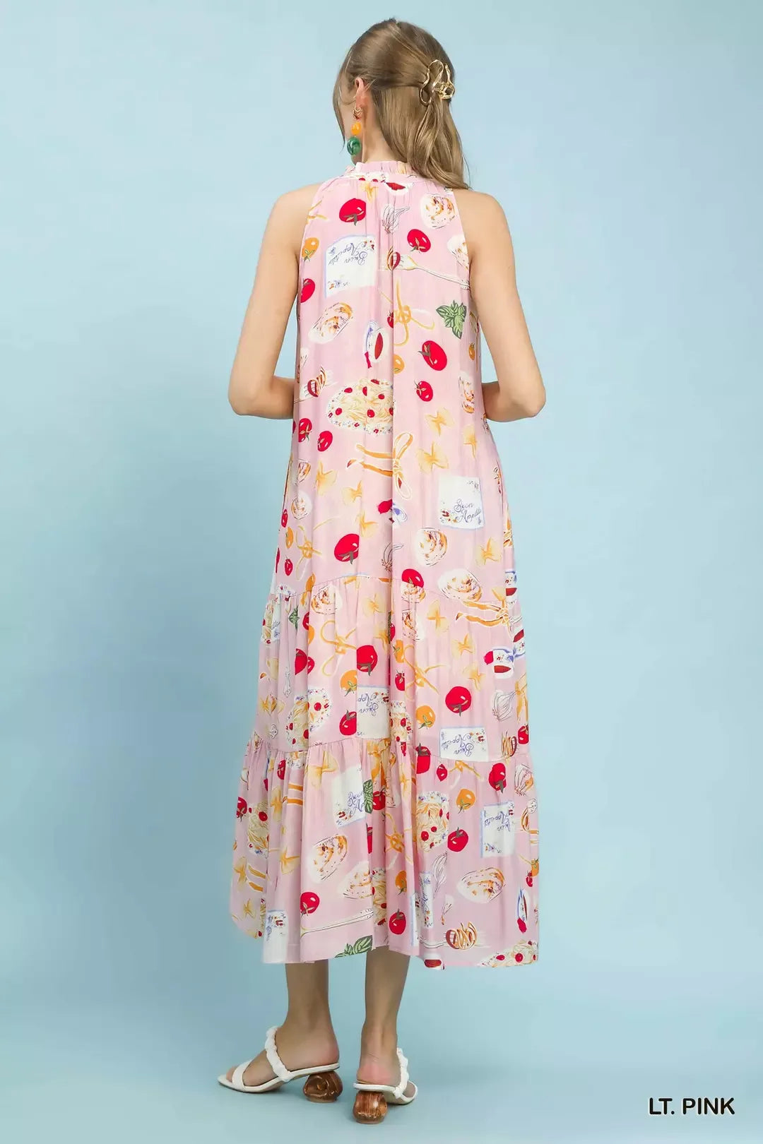 Light pink halter tiered midi dress, back view with colorful abstract fruit print