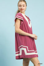 Berry linen short-sleeve dress with white contrast stripes and panel detailing at hem.