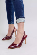 Dark blue skinny jeans with cuffed hem and stitched seam details