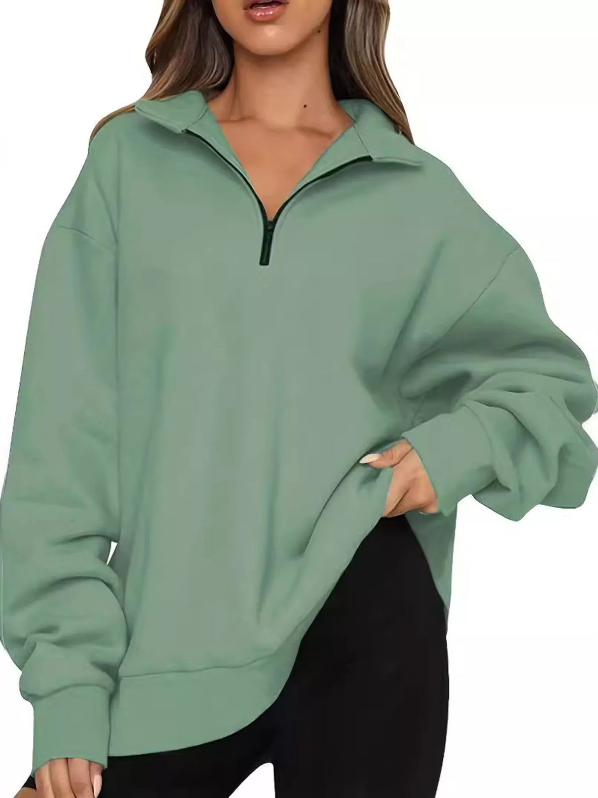 Light green oversized zip-neck sweatshirt with black-trim half-zip and relaxed cuffs