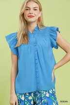 Ocean blue smocked yoke ruffle cap sleeve blouse with V-neck and button placket