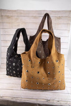 Suede grommet shoulder totes: tan and black, each with silver eyelet detailing and handles