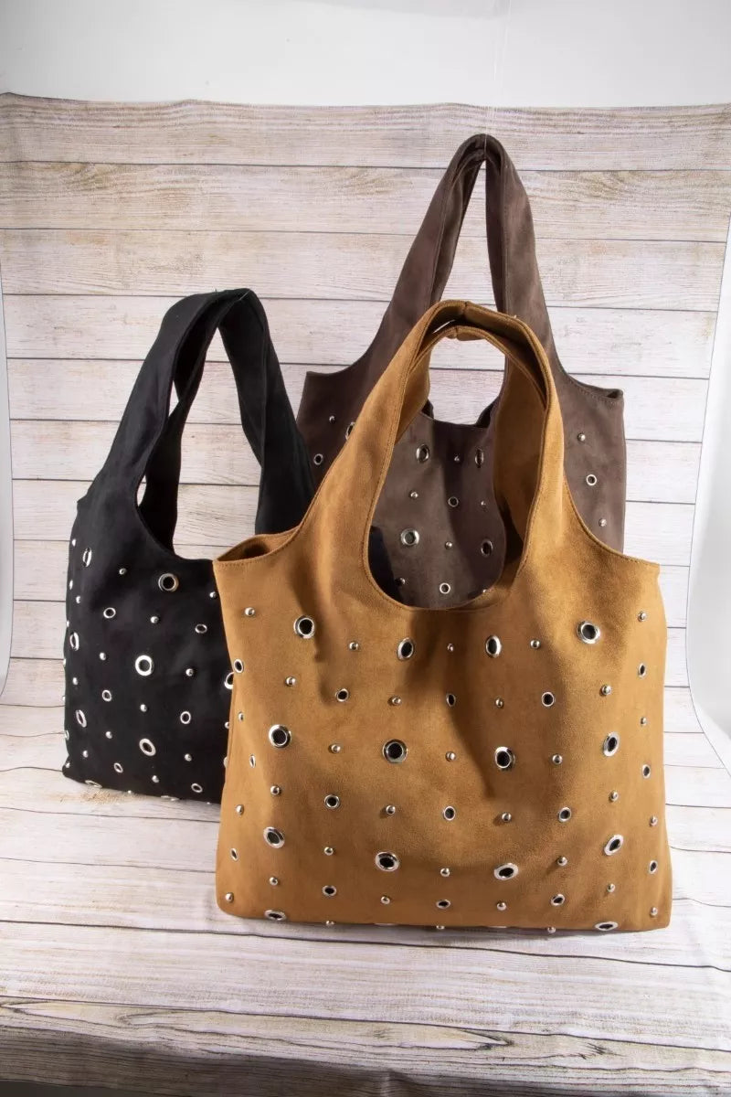 Suede grommet shoulder totes: tan and black, each with silver eyelet detailing and handles