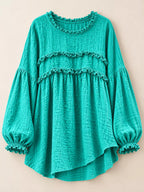 Teal frayed trim peplum blouse front view with tiered ruffle bands and elastic puff cuffs