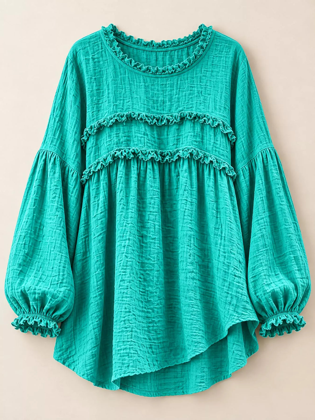 Teal frayed trim peplum blouse front view with tiered ruffle bands and elastic puff cuffs