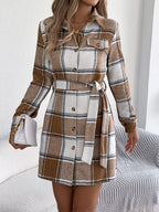 Brown plaid shirt dress with button-up front, long sleeves, and waist tie belt