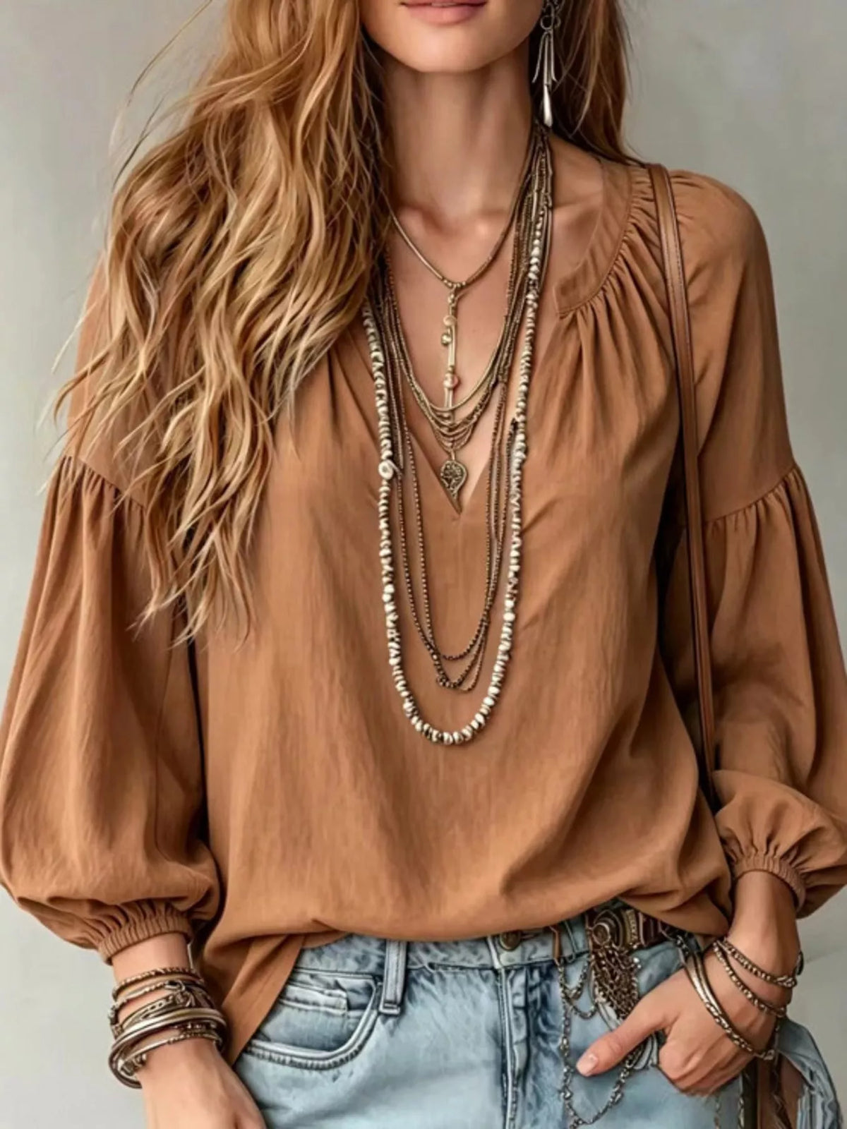 Brown notched V-neck blouse with gathered balloon sleeves and elastic cuffs