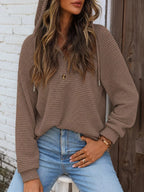 Taupe brown waffle-knit hoodie with hood, two-button front, and drawstring ties