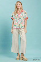 Floral print v-neck oversized blouse with pink button placket and short sleeves