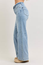 Light wash mid-rise wide-leg jeans, back view with yoke seam