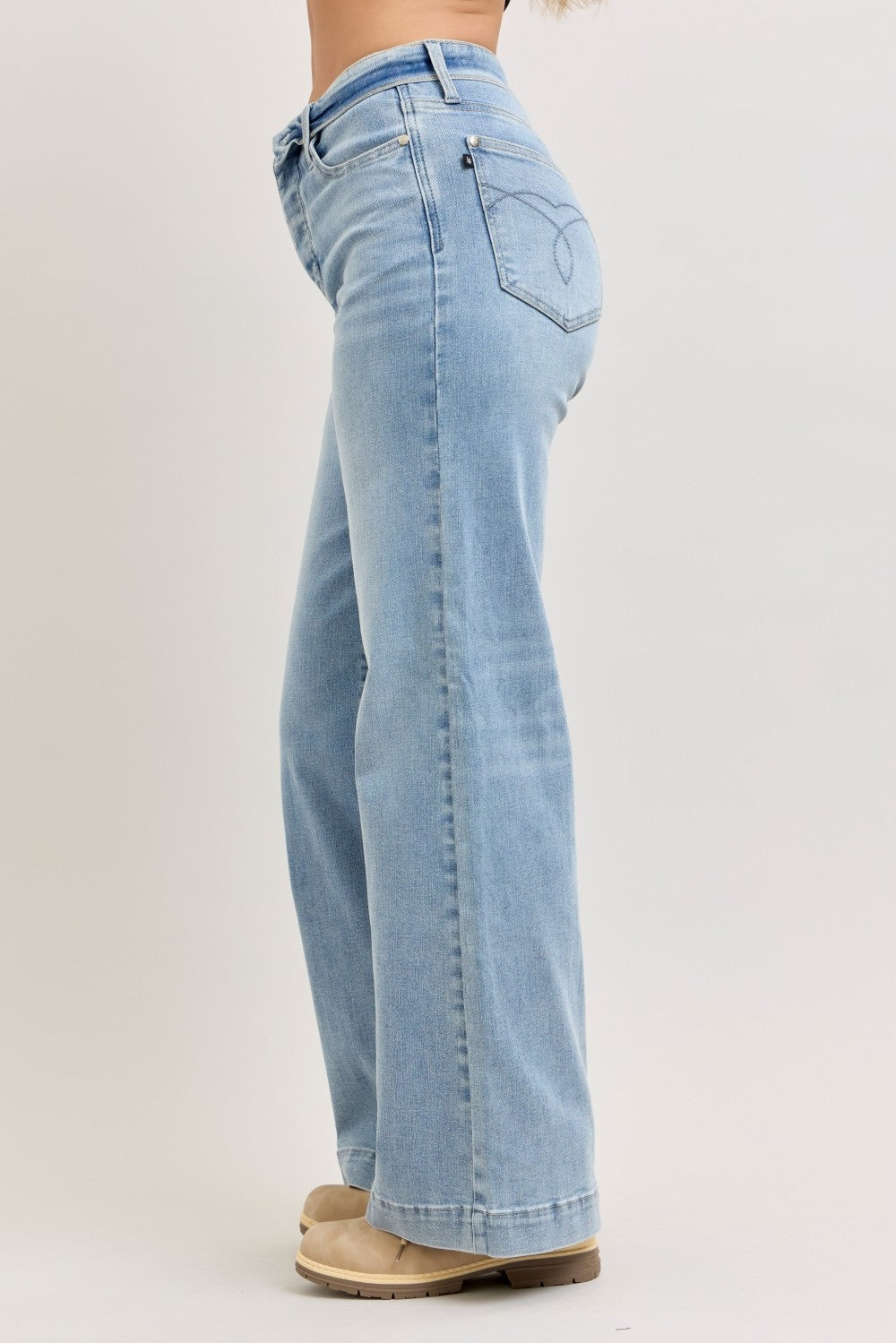 Light wash mid-rise wide-leg jeans, back view with yoke seam